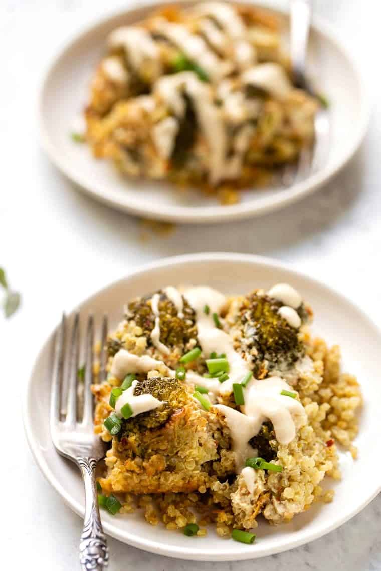 A piece of broccoli-quinoa salad drizzled with tahini on a serving plate.