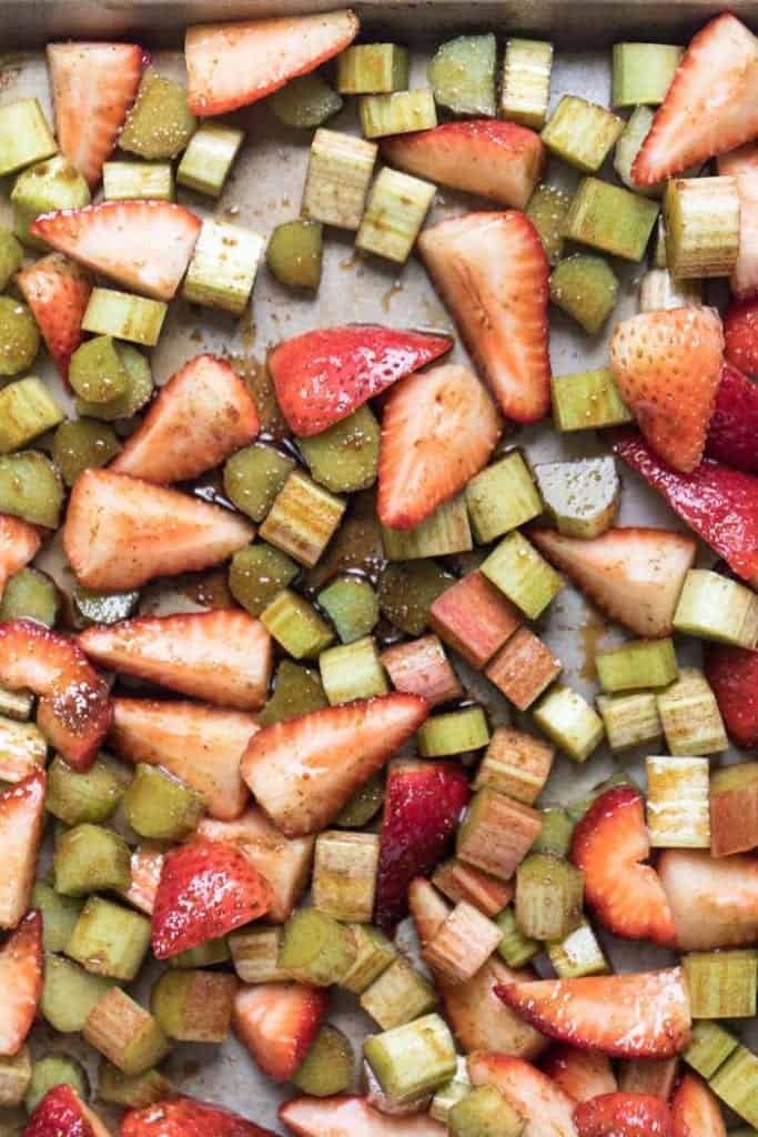 Overhead view of strawberry and rhubarb mixture on sheet pan