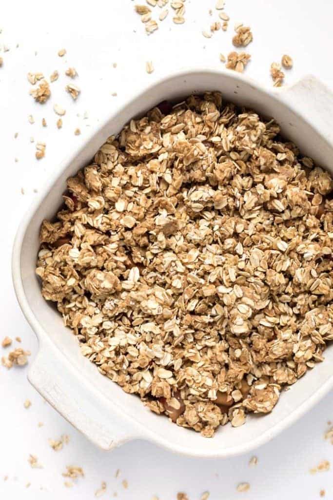 Overhead view of strawberry rhubarb crisp in square baking dish