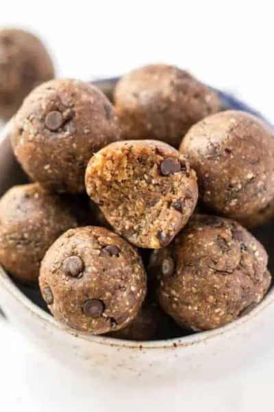 A bowl of healthy peanut butter energy balls with oats and chocolate chips