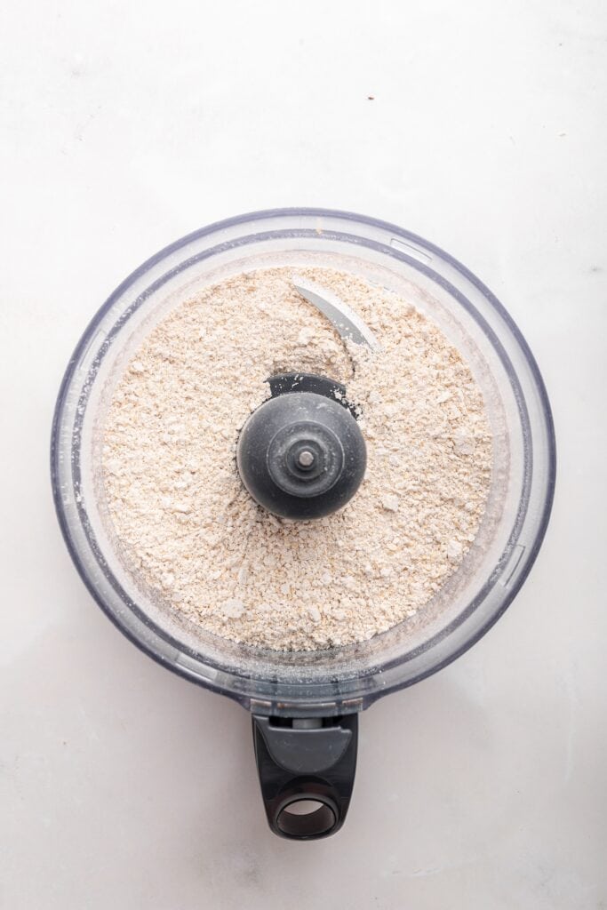 Overhead view of oat flour in food processor