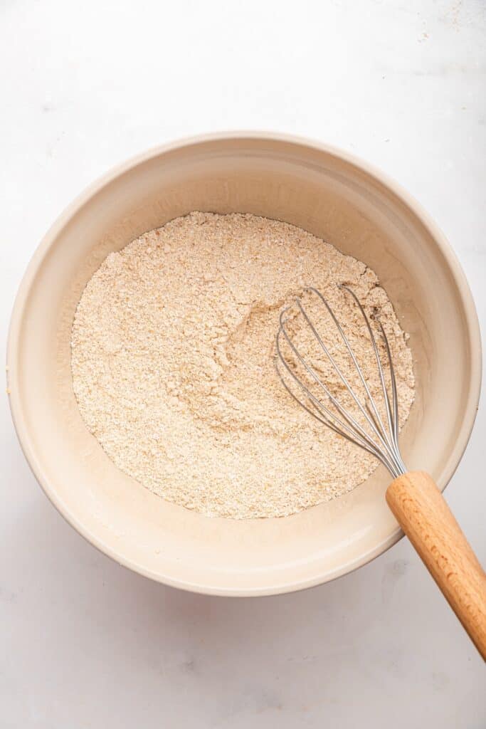 Whisking dry ingredients for oatmeal pancakes