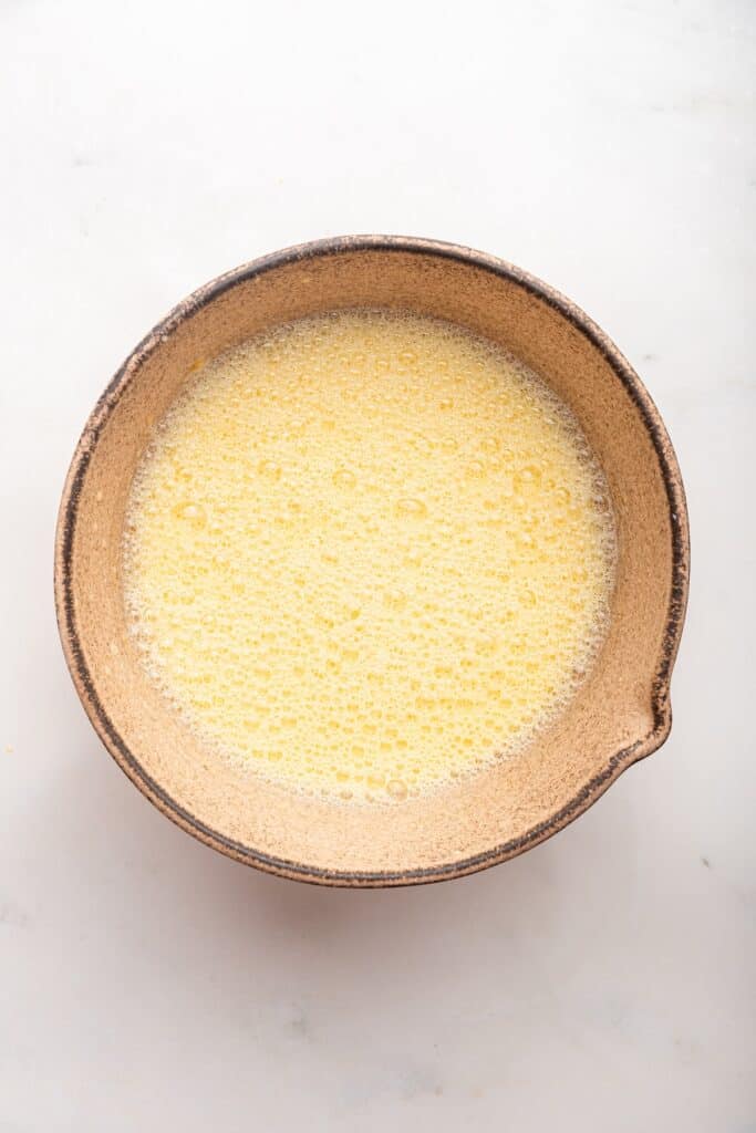 Liquid ingredients for oatmeal pancakes in mixing bowl