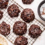 Overhead view of no-bake chocolate cookies on wire rack and countertop