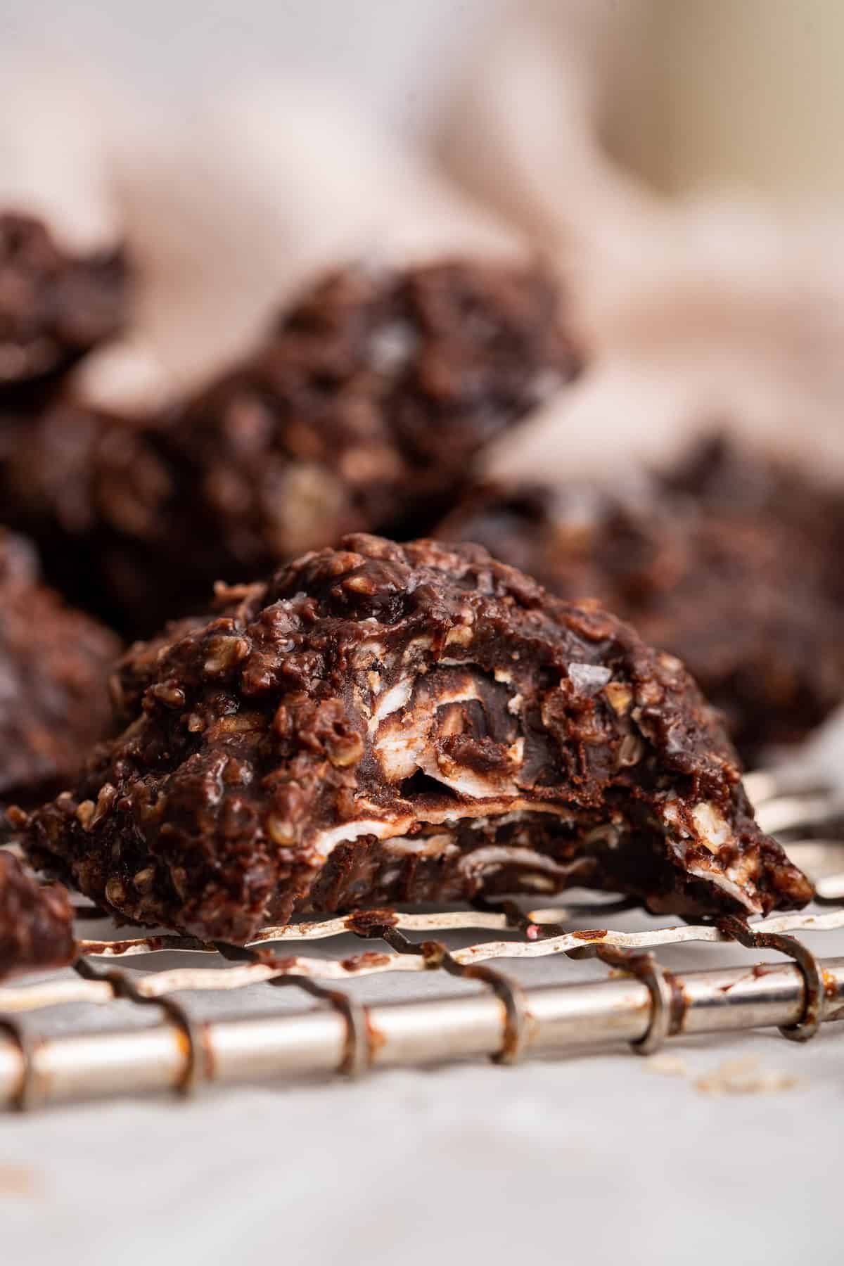 No-bake chocolate cookie bitten to show fudgy texture