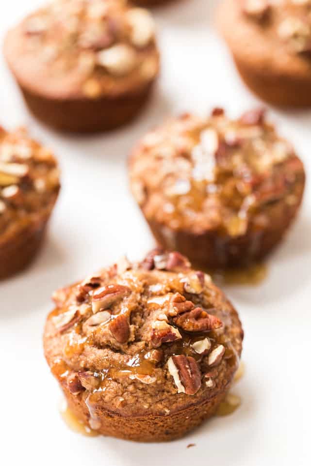 Applesauce blender muffins topped with honey and pecans