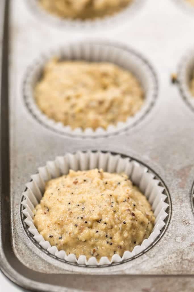 Lemon poppy seed muffin batter in liner