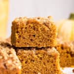 Two pieces of pumpkin coffee cake stacked