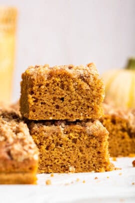 Two pieces of pumpkin coffee cake stacked