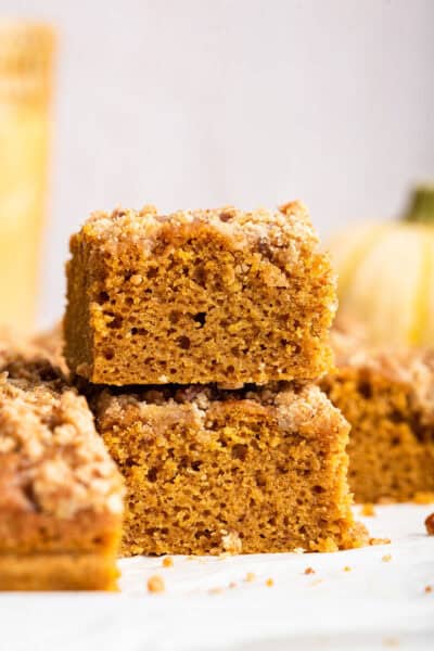 Two pieces of pumpkin coffee cake stacked