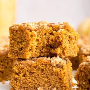 Two pieces of pumpkin coffee cake stacked