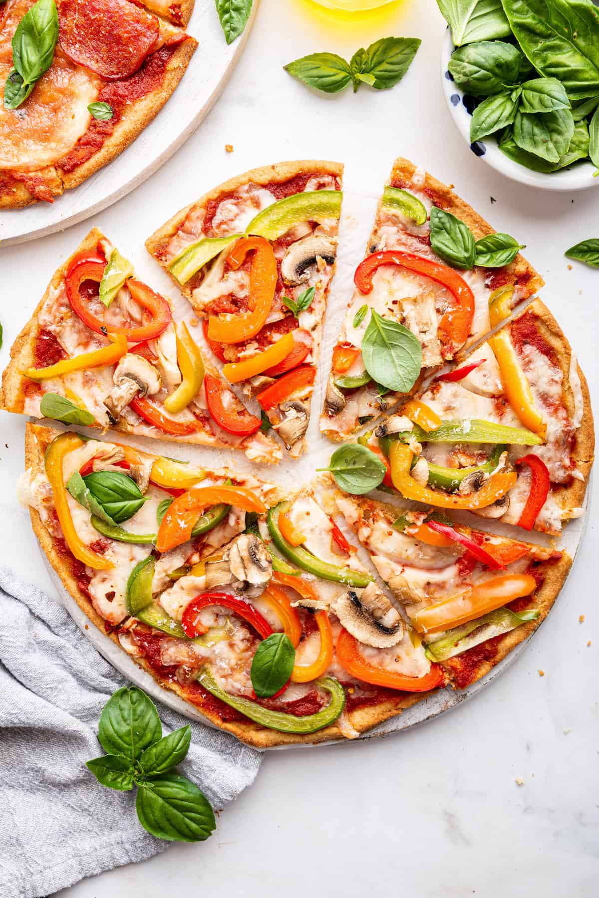 Overhead view of sliced almond flour pizza