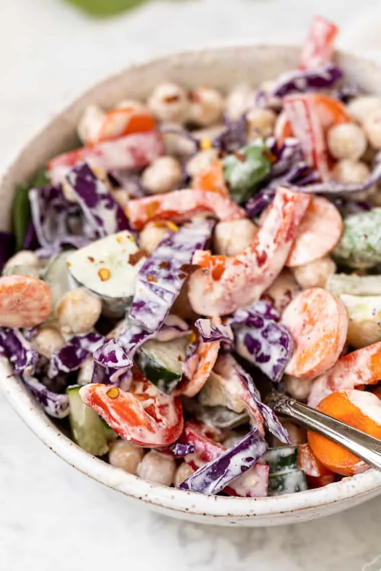 Close up of a mason jar salad served in a bowl.