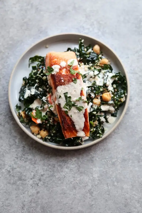 https://www.simplyquinoa.com/wp-content/uploads/2021/09/Seared-Salmon-and-Quinoa-Bowls-with-Massaged-Kale-Chickpeas-and-Lemon-Tahini-Sauce_-4.webp