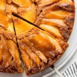 slcie of upside down apple cake on a pan