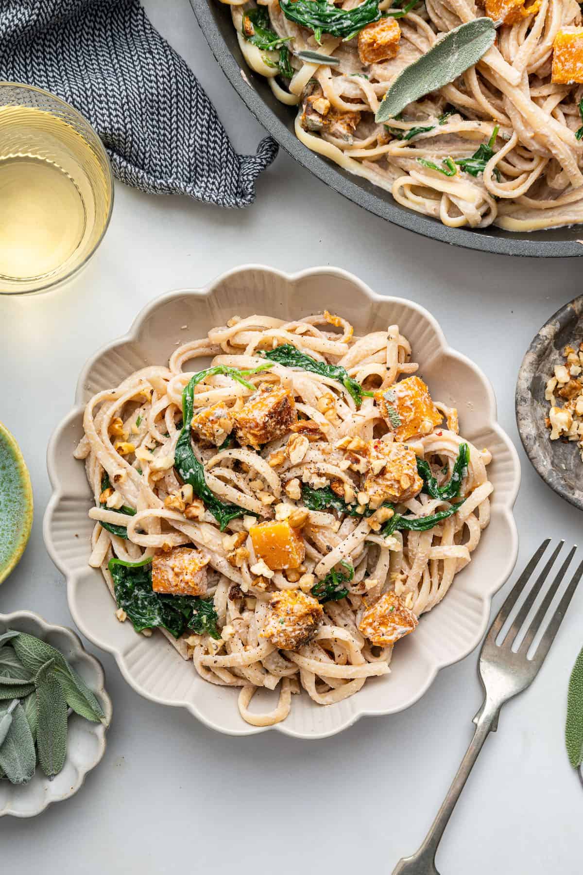 Overhead view of walnut pasta with butternut squash in bowl