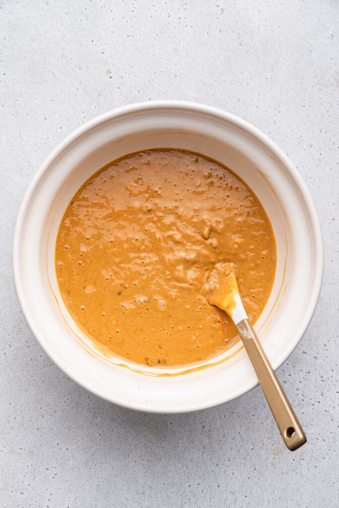 Overhead view of carrot bread batter in bowl