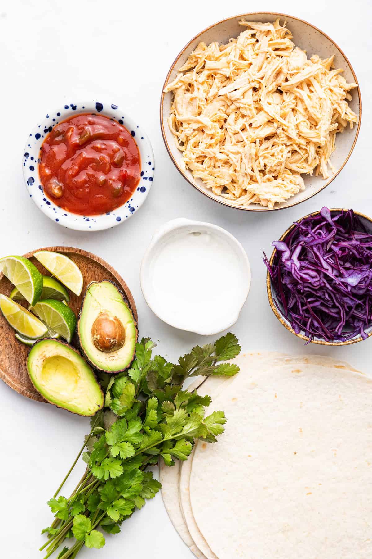 Overhead view of ingredients for Instant Pot shredded chicken tacos