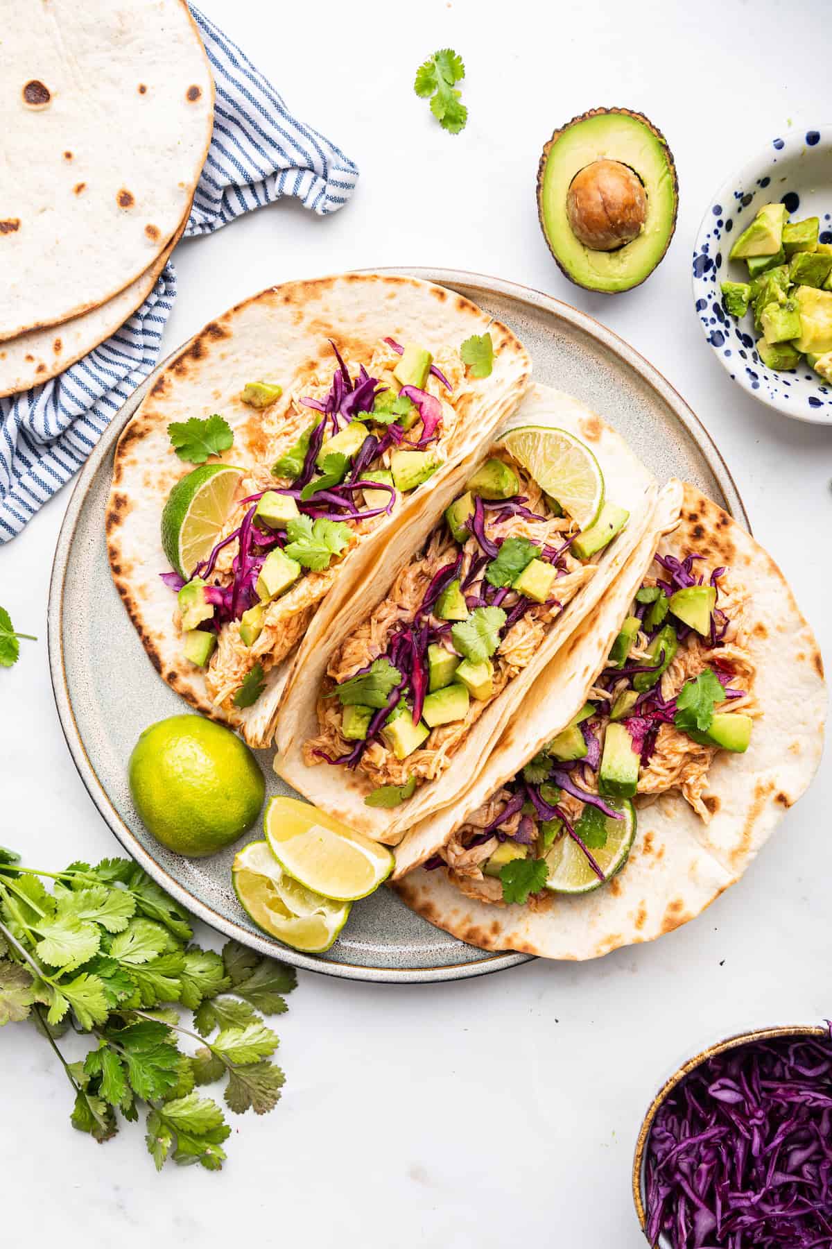 Overhead view of 3 Instant Pot shredded chicken tacos on plate