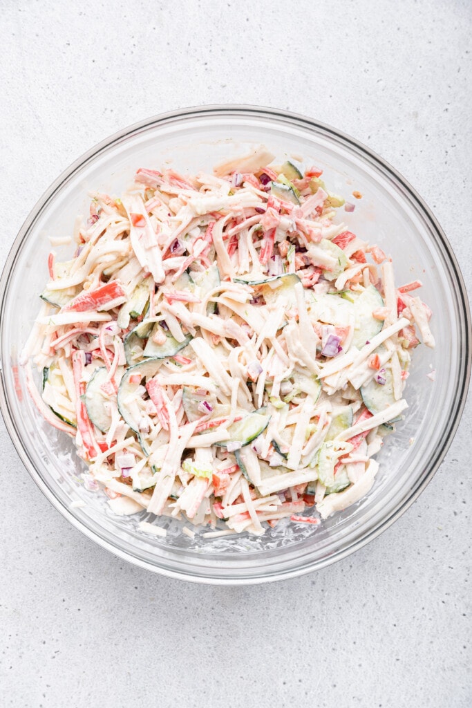 Overhead view of surimi salad in mixing bowl