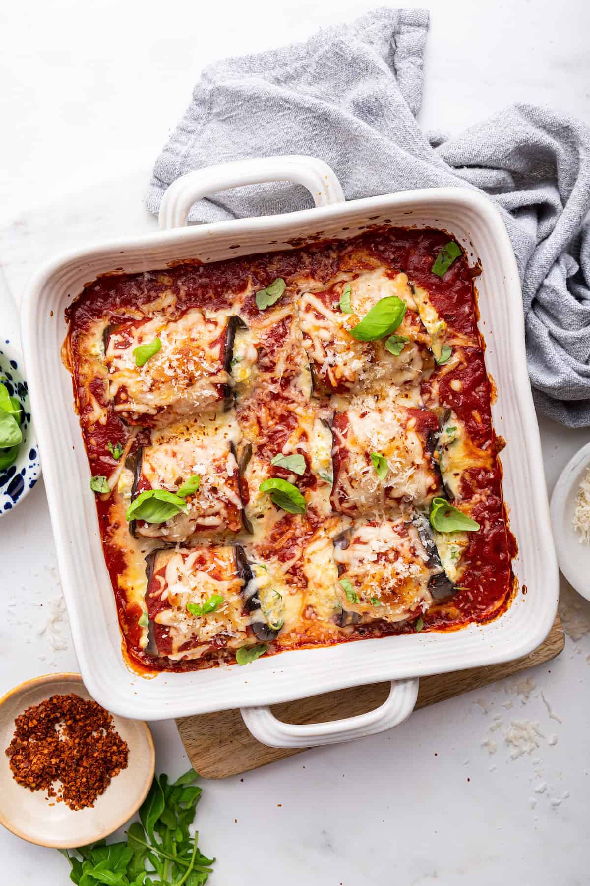 Overhead view of eggplant rollatini in square baking dish