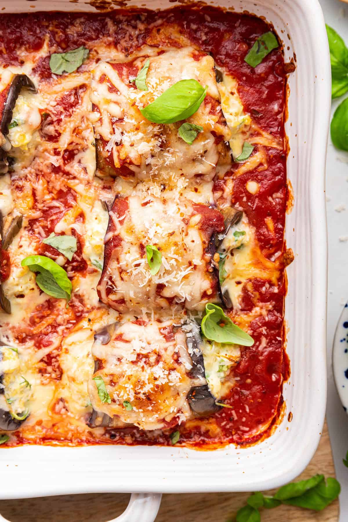 Overhead view of eggplant rollatini with cheese and marinara