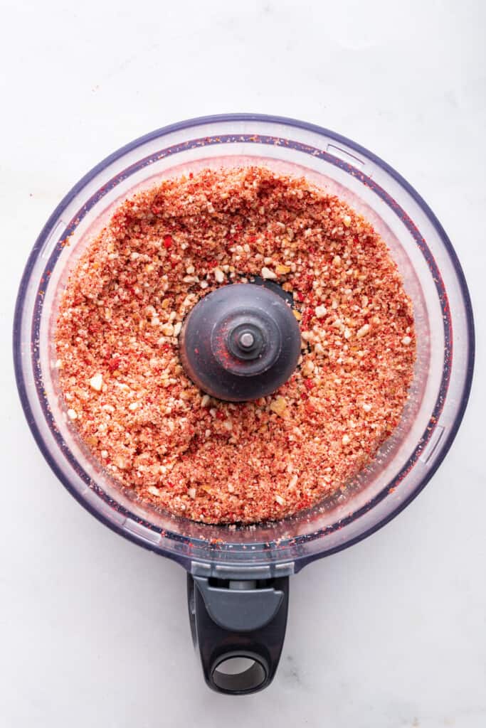 Overhead view of crumbs for strawberry shortcake ice cream bars in food processor