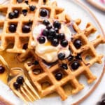 Overhead view of plate of blueberry waffles