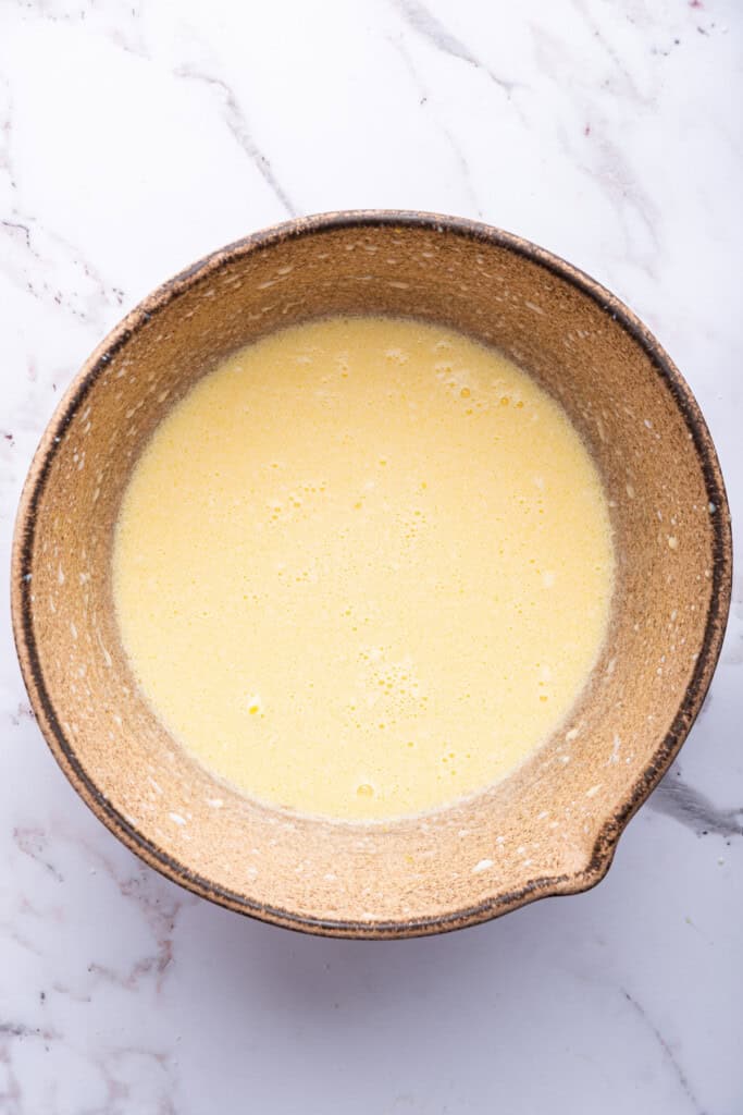 Wet ingredients for waffles in mixing bowl