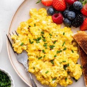 Plate of cottage cheese scrambled eggs with fresh berries