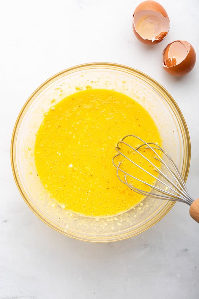 Whisking together eggs and cottage cheese