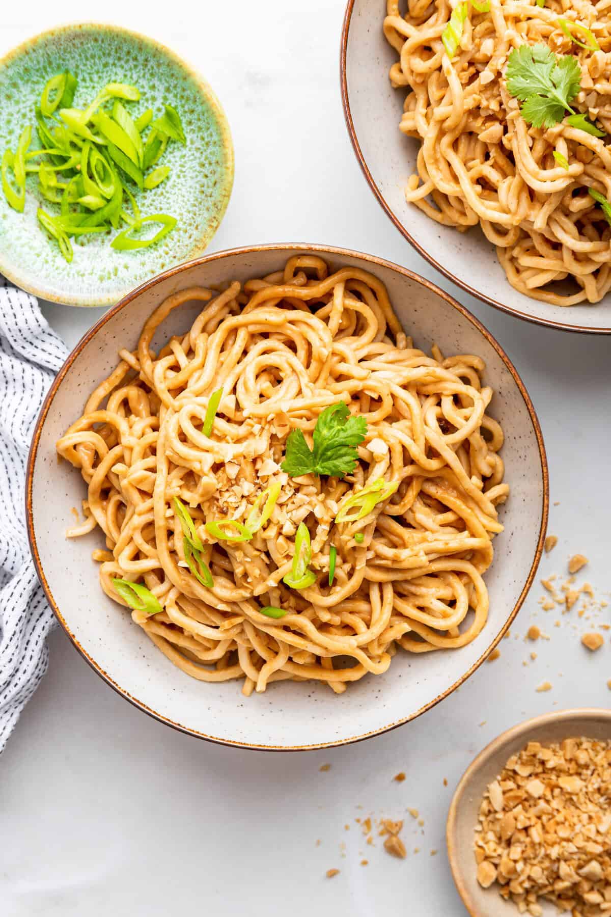 Overhead view of peanut noodles in bowls