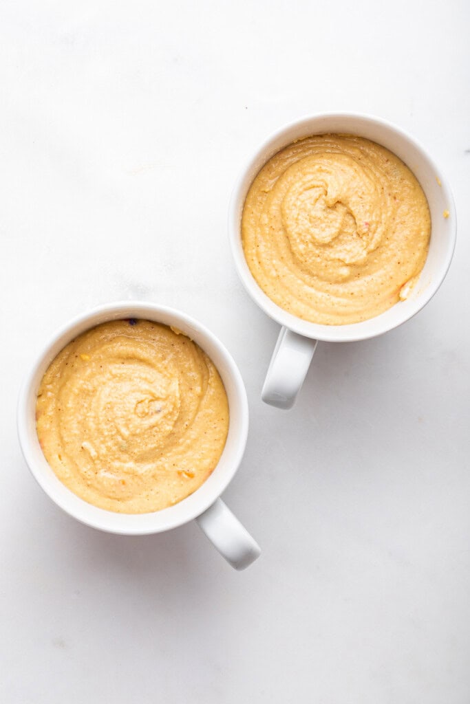 Batter for protein cake in two mugs