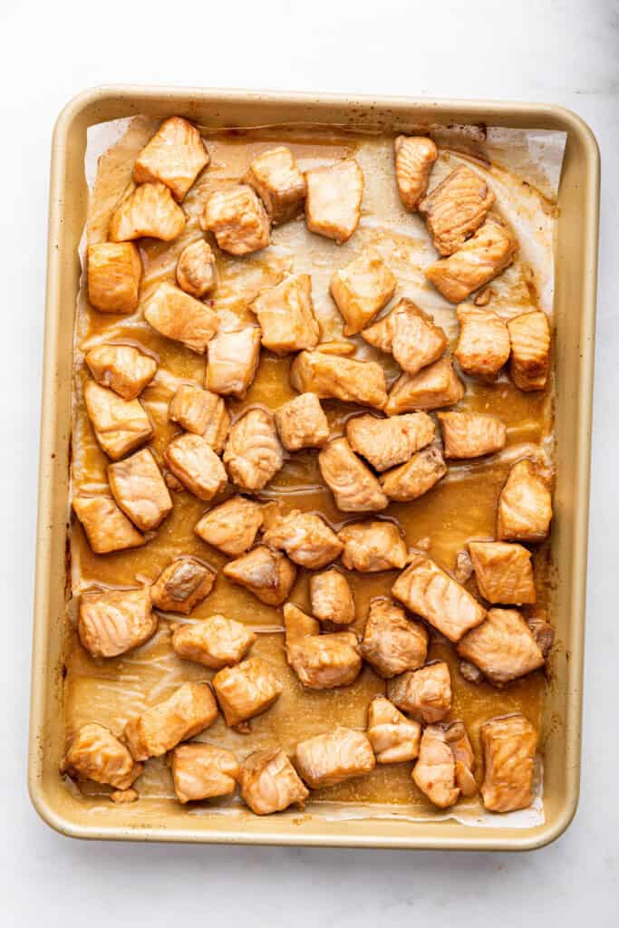 Overhead view of salmon on baking sheet