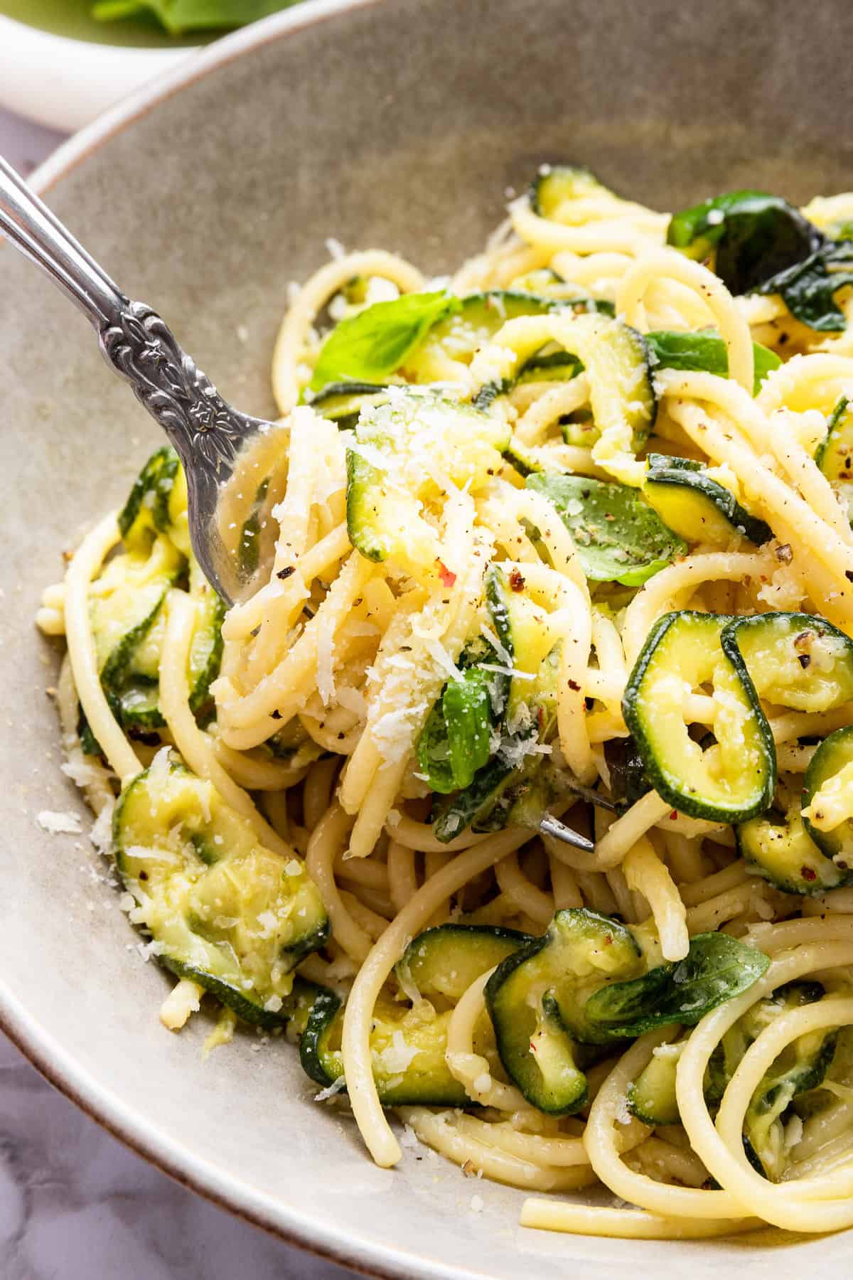 Bowl of spaghetti alla Nerano with fork