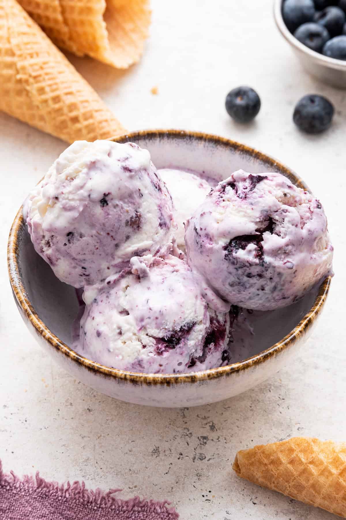 Scoops of berry cottage cheese ice cream in bowl