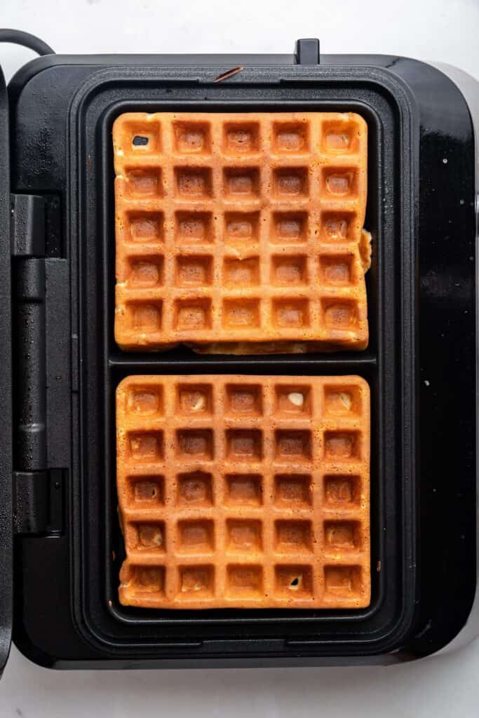 Overhead view of protein waffles in waffle iron