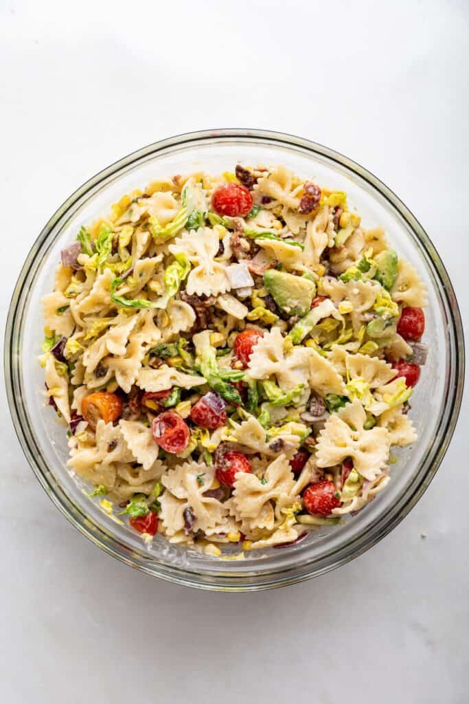 Overhead view of BLT pasta salad in mixing bowl