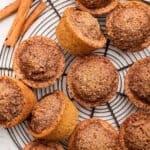 Overhead view of healthy cinnamon muffins on wire rack