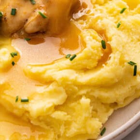 Closeup of dairy-free mashed potatoes on plate with gravy