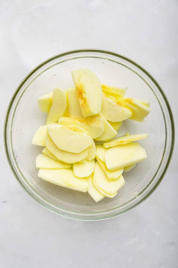 Apple slices in glass bowl