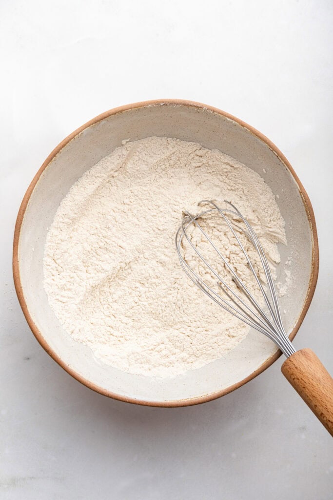 Whisking dry ingredients in mixing bowl