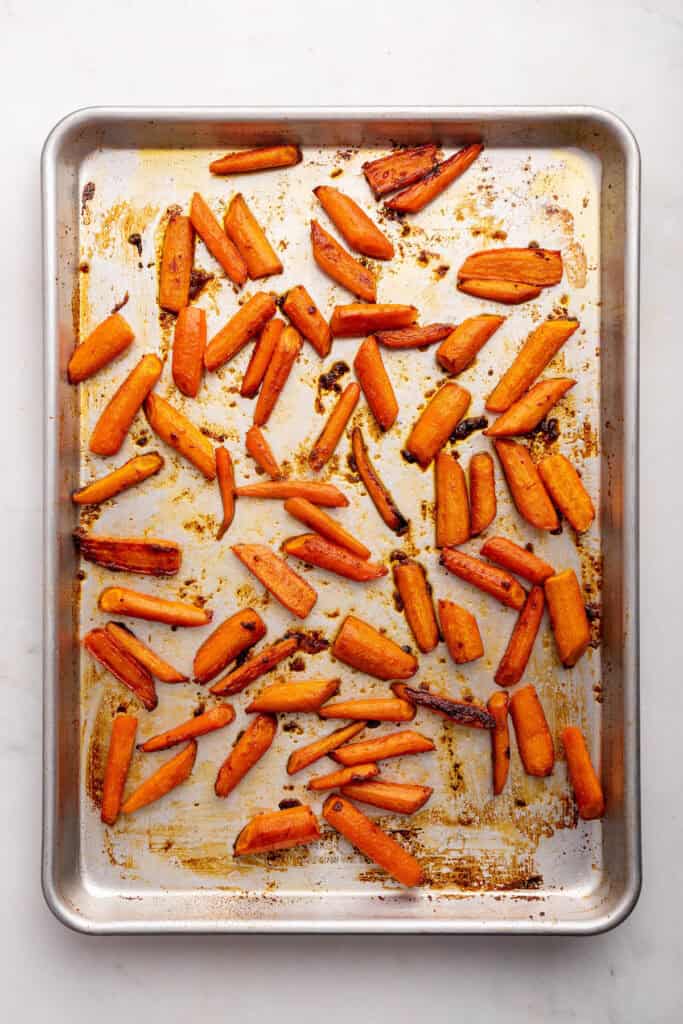 Overhead view of honey roasted carrots on sheet pan