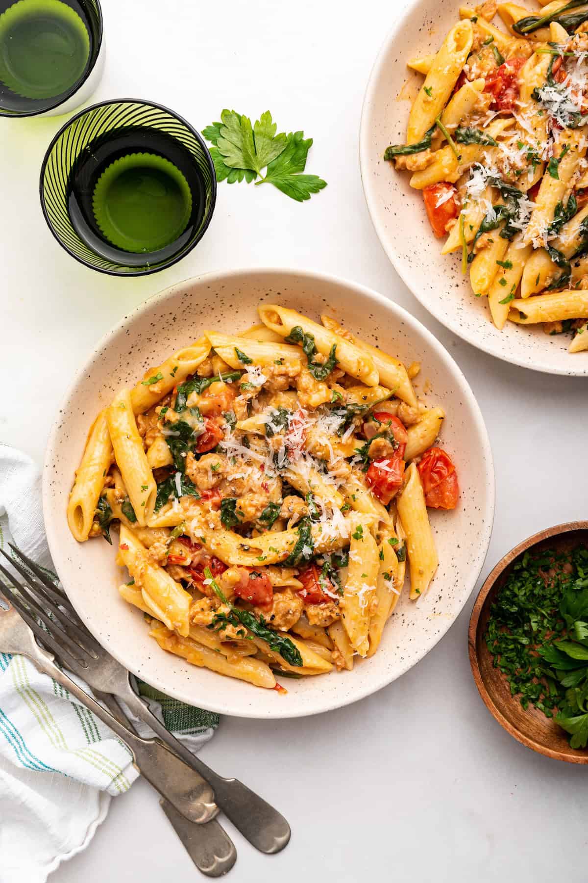 Overhead view of Italian sausage pasta in 2 bowls