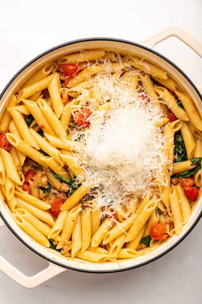 Cheese added to sausage pasta