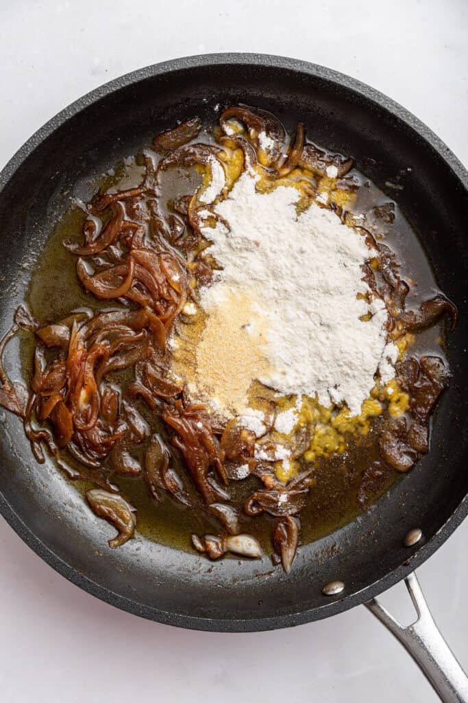 Flour added to pan of caramelized onions