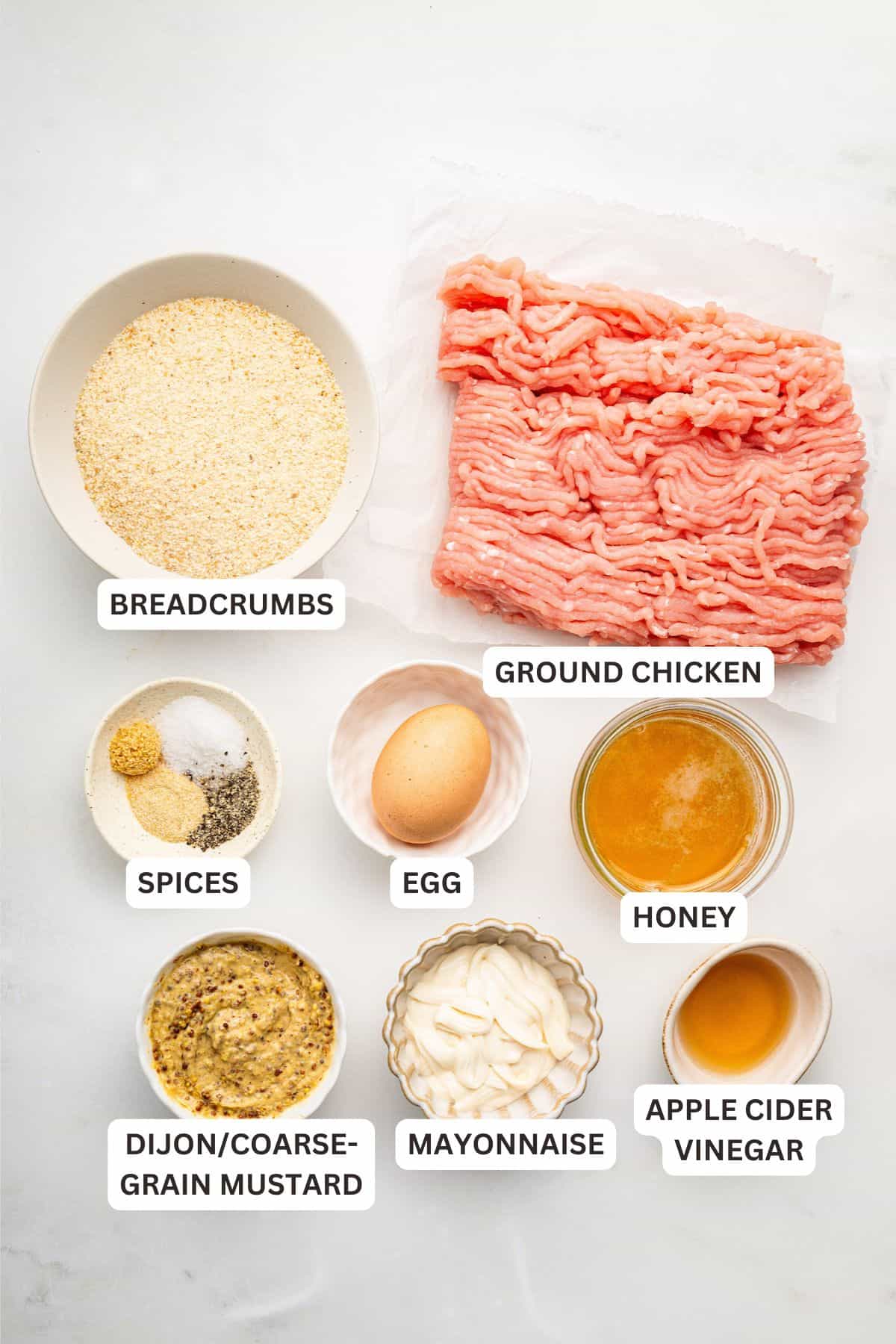 Overhead view of ingredients for homemade chicken nuggets with labels