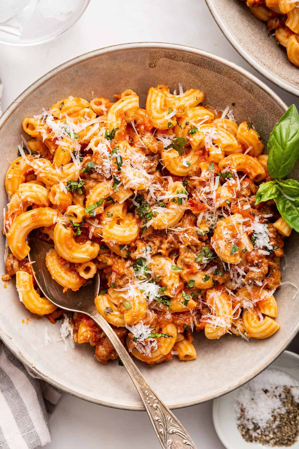 Homemade beefaroni in bowl with spoon