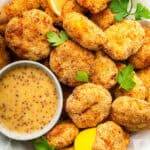 Plate of homemade chicken nuggets with dipping sauce