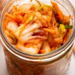 Top-down view of kimchi recipe in glass jar